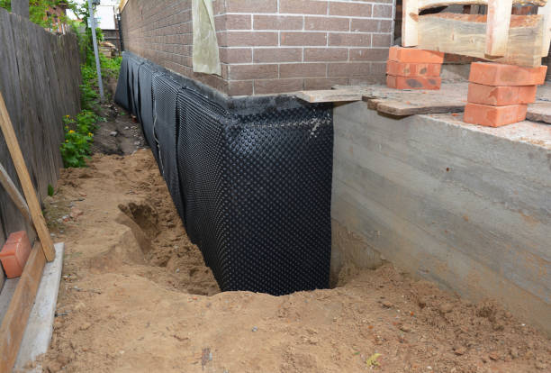 SJ Waterproofing Pros technician performing targeted Exterior Waterproofing assessment in Linden, TN